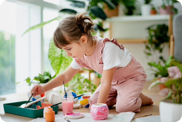 Child painting and creating art